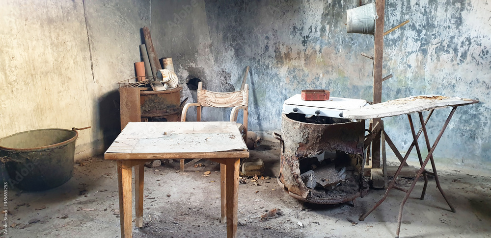 An old, abandoned room with old furniture. Poverty. An old, abandoned room with old furniture. Poverty.