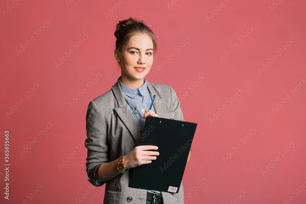 Young serious businesswoman thinking at new report for newspaper and tabloids standing over pink background. Worrying Girl waiting for interview, exam, medical test result, financial issues anxiety Young serious businesswoman thinking at new report for newspaper and tabloids standing over pink background. Worrying Girl waiting for interview, exam, medical test result, financial issues anxiety