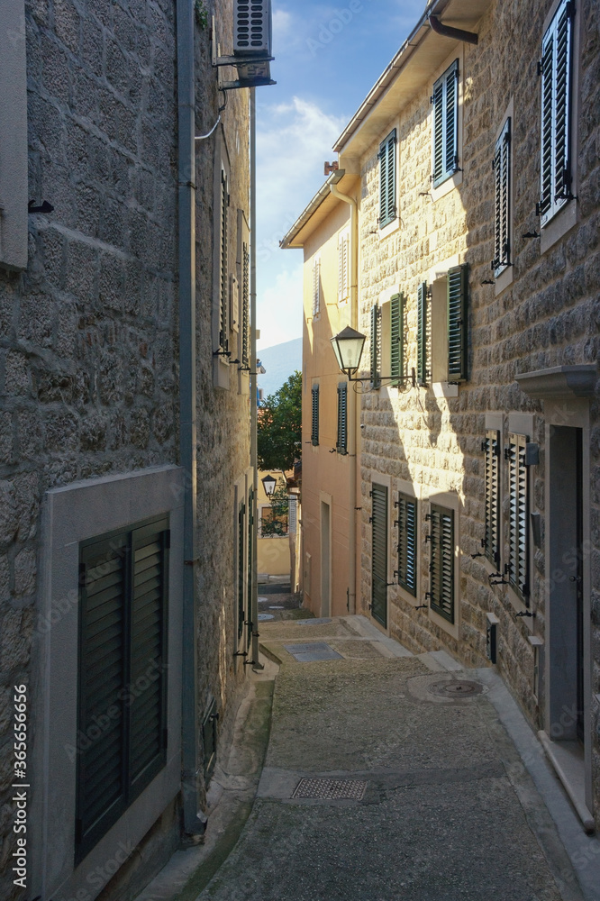 Old narrow street in Mediterranean city. View of Old Town of Herceg Novi. Montenegro
