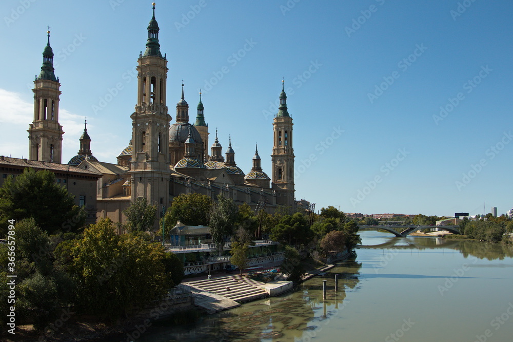 Cathedral-Basilica of Our Lady of the Pillar and the bridge Puente de Santiago over the river Ebroin in Zaragoza,Spain,Europe
