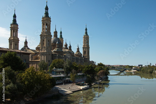 Cathedral-Basilica of Our Lady of the Pillar and the bridge Puente de Santiago over the river Ebroin in Zaragoza Spain Europe 
