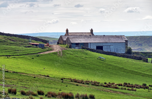A rural farmhouse on a slope in Northumberland