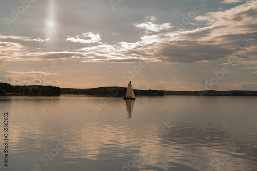 sailing yacht against the sunset sky, background. photo