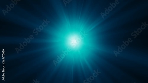 Blue rays of light flare outwards, making a sun-like effect against a dark background.