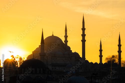 Silhouette of Suleymaniye Mosque with orange sky at sunset