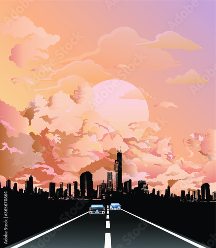 Traffic on roadway leading to generic silhouetted city skyline with stunning dawn or dusk pink sky 