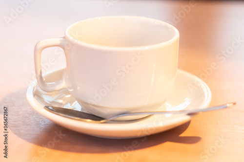 Obraz na płótnie white mock up cup and saucer with spoon on wooden table close up w salonie