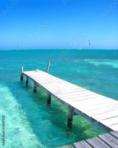 Tropical water in Belize with pier