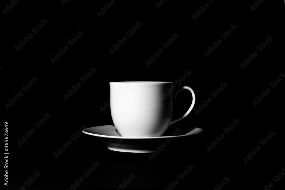 A cup on the black background with key light A cup on the black background with key light