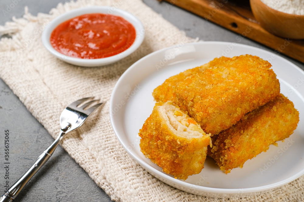 Delicious Risoles or Risol Mayo is a typical Indonesian traditional street food made from flour skin, meat and vegetables stuffing inside with mayonnaise and chili sauce. Delicious Risoles or Risol Mayo is a typical Indonesian traditional street food made from flour skin, meat and vegetables stuffing inside with mayonnaise and chili sauce.