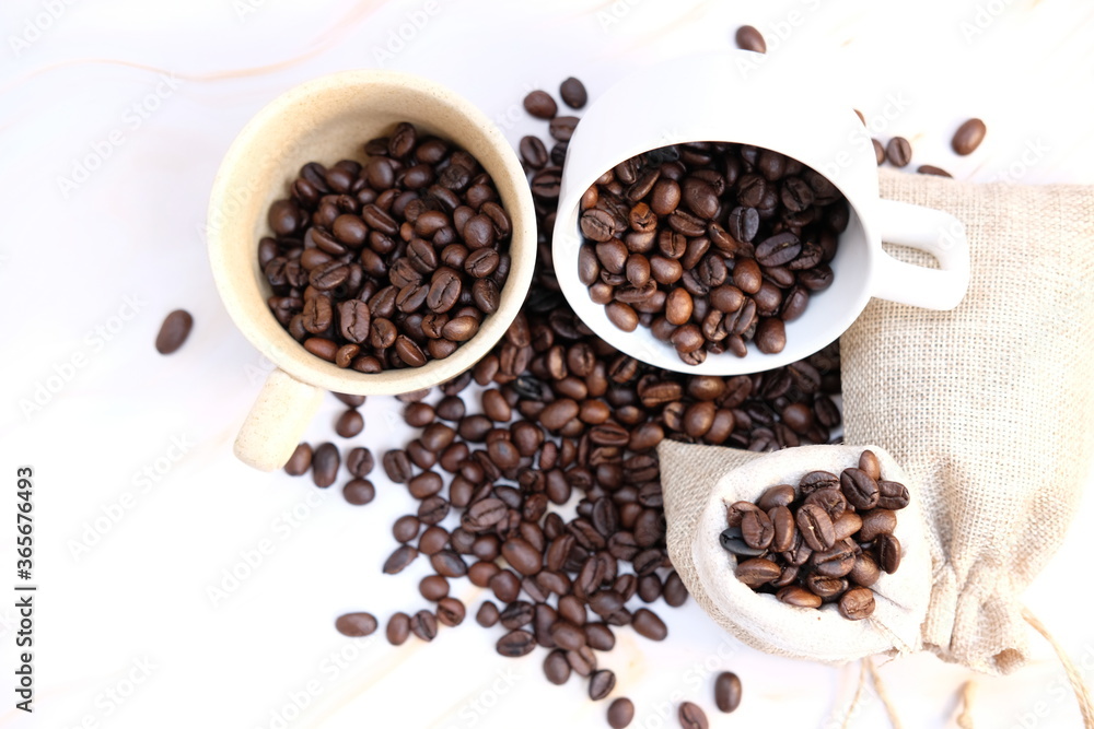 coffee cup and coffee beans on wood table