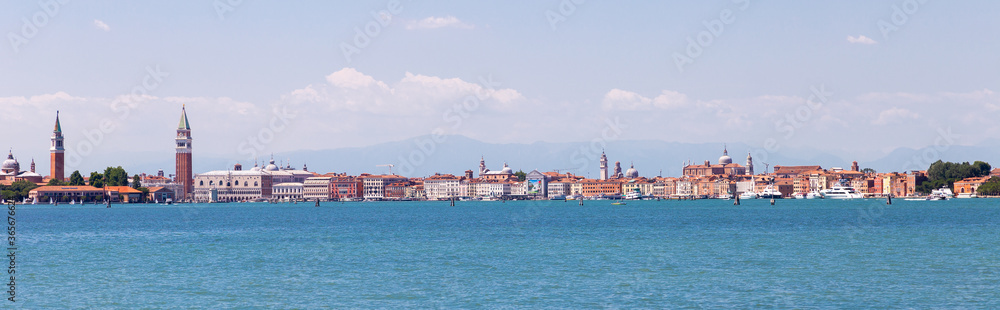 Panoramic view from the canal to Venice, Italy. Doge's Palace, Campanile of the Cathedral of St. Mark, Prison Palace, basalis. Banner, selective focus.