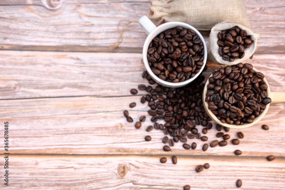 coffee beans on wooden background coffee beans on wooden background