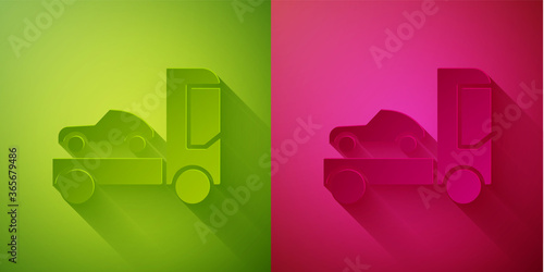 Paper cut Car transporter truck for transportation of car icon isolated on green and pink background. Paper art style. Vector Illustration.