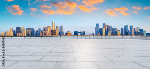 Hangzhou city skyline and commercial buildings with empty square floor,China.