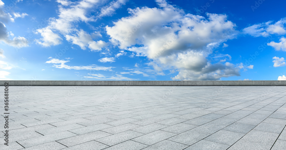 Empty square floor and blue sky with white clouds scene.