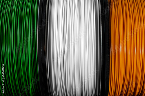 Ireland flag of the coils for 3D printer. Filament for 3d printing, Bright thermoplastic of green, white and orange