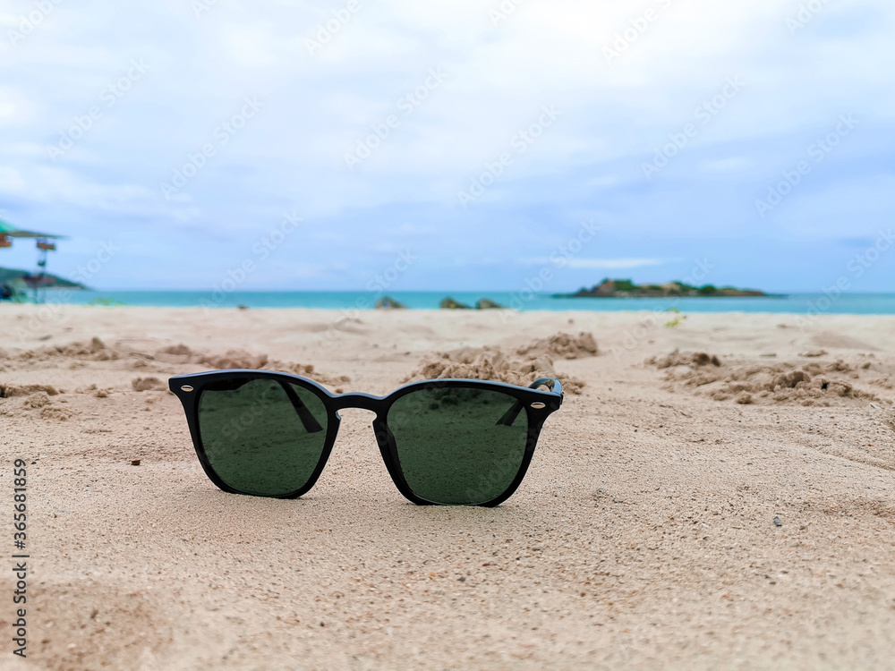 Sunglasses Put on sand The Beach of Samae San Island in Chon Buri in Thailand