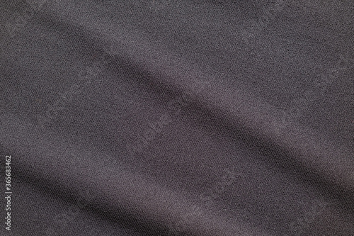 Top view close up shot of Black grey fabric cotton shirt with woven gradient detail. Background and wallpaper concept.