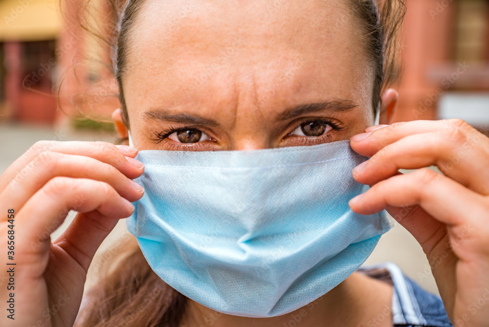 girl in a medical mask close up. coronavirus.