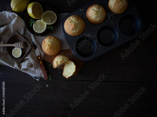 Lemon Muffins on Black Table with Copy Space. Lemon Cup Cakes Rustic Shot. Lemon Muffins Flatlay.