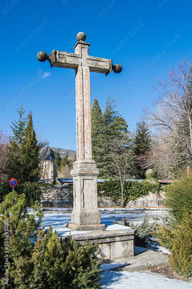stone cross and snowy landscape outside the Monastery of Paular, Rascafría, province of Madrid. Spain stone cross and snowy landscape outside the Monastery of Paular, Rascafría, province of Madrid. Spain