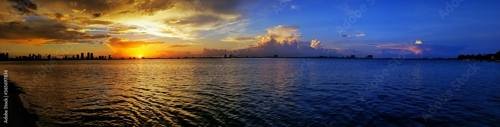 Naklejka premium sunset over the river