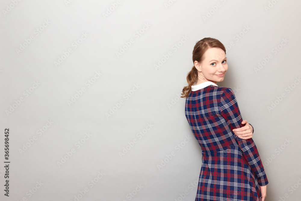Portrait of happy girl turning around and smiling joyfully Portrait of happy girl turning around and smiling joyfully