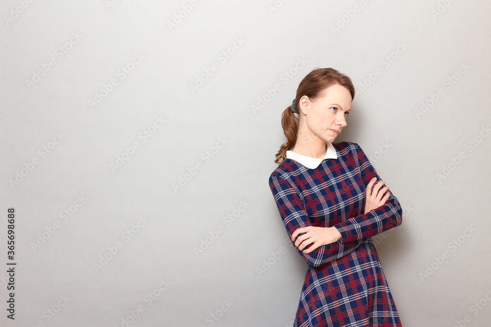 Portrait of serious thoughtful girl holding arms folded Portrait of serious thoughtful girl holding arms folded