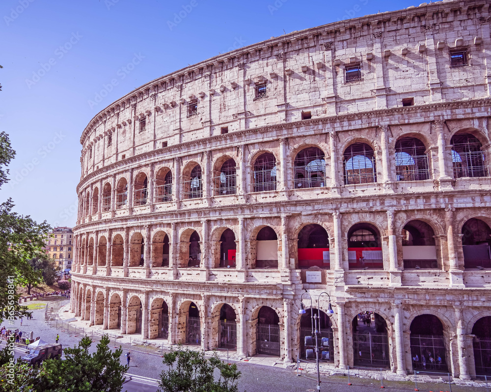 Rome Italy, impressive view of the Colosseum ancient amphitheater under clear blue sky