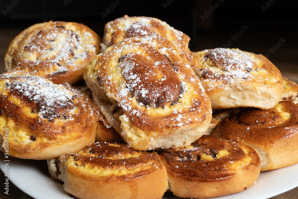 Patties with cottage cheese and raisins piled up on a plate.