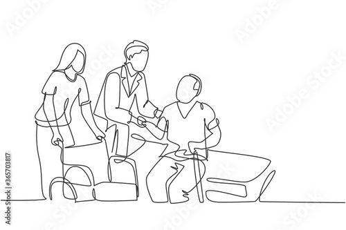 One single line drawing of young male doctor helping old patient get to wheelchair from hospital bed. Trendy medical health care service concept continuous line draw design vector graphic illustration