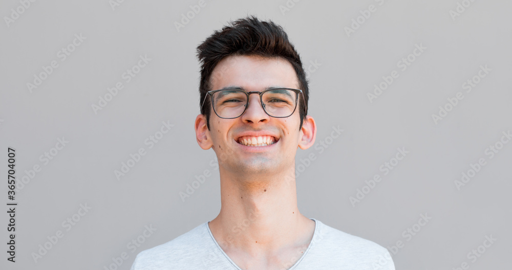 Close up portrait of a handsome guy with a smile on his face Close up portrait of a handsome guy with a smile on his face