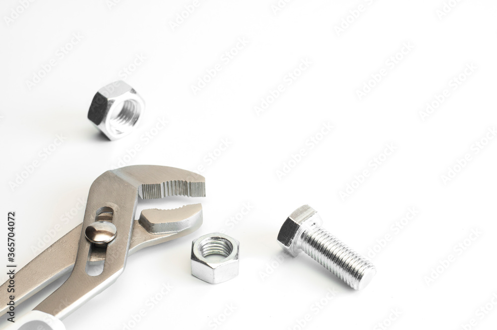 Wrench. Bolt and nut. On a white background. Isolated. Repair services. Plumbing