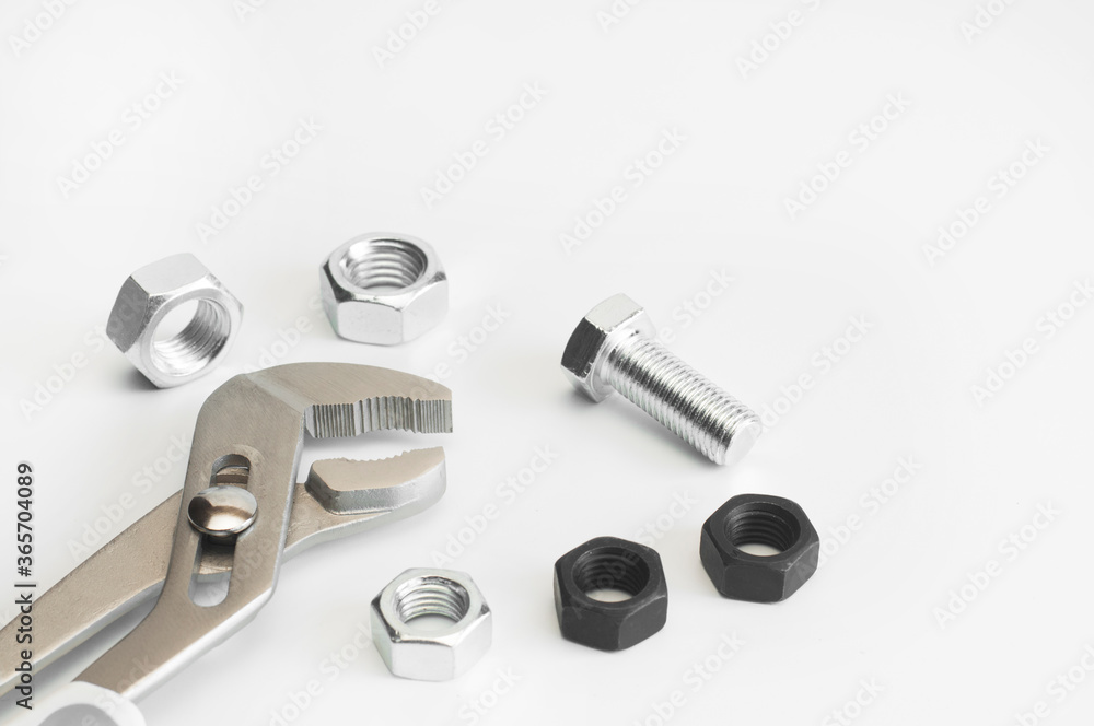 Wrench. Bolt and nut. On a white background. Isolated. Repair services. Plumbing Wrench. Bolt and nut. On a white background. Isolated. Repair services. Plumbing