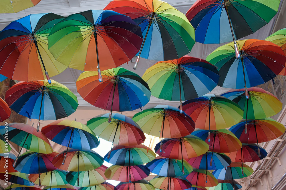 Obraz premium Multi coloured umberallas make a shady canopy over the side streets of Bucharest