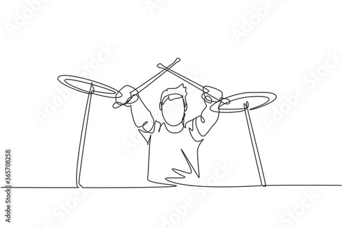 One single line drawing of young male drummer crossing the drumstick while playing drum set on music festival stage. Musician artist performance concept continuous line draw design vector illustration