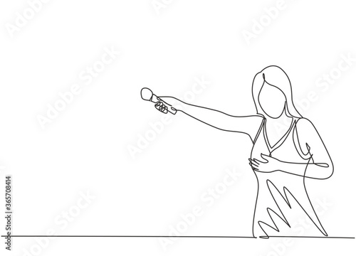 One continuous line drawing of young happy female singer hold microphone and invite audience to sing on music concert. Musician artist performance concept single line draw design vector illustration photo