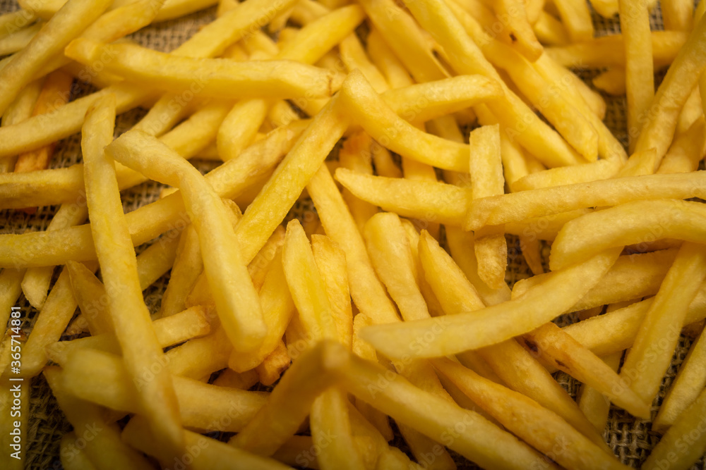 French fries scattered surface texture. Close up. French fries scattered surface texture. Close up.