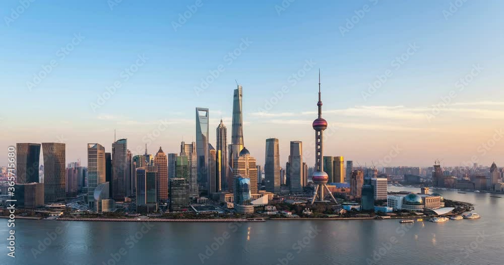 dusk scene in shanghai, time lapse of beautiful pudong financial center and huangpu river in sunset, China. dusk scene in shanghai, time lapse of beautiful pudong financial center and huangpu river in sunset, China.