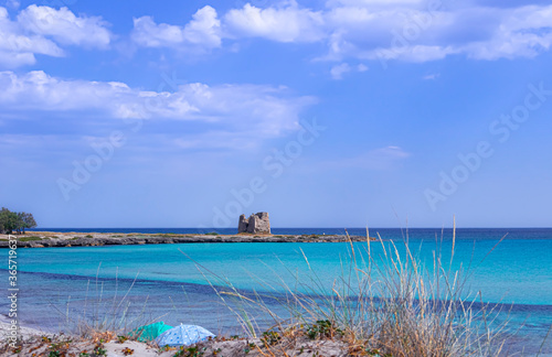 Marina di Lizzano: Torretta Beach, Apulia (Italy).On background Zozzoli Watchtower. The coastline is characterized by a alternation of sandy coves and jagged cliffs overlooking a crystalline sea. photo