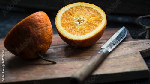 Sliced orange on a wooden board