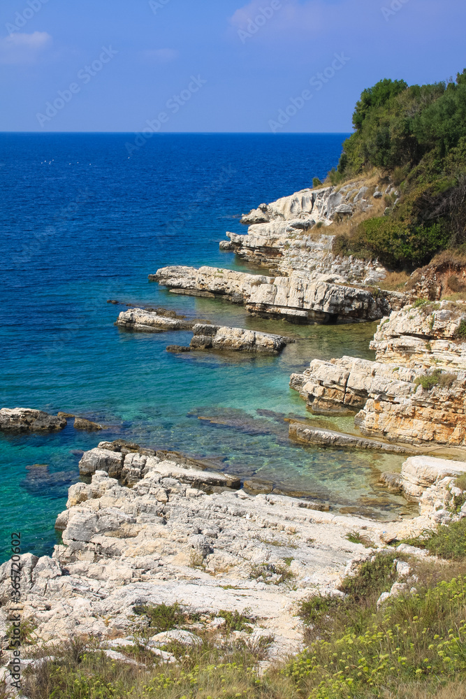 Blue sea and rocky shore in Corfu, Greece