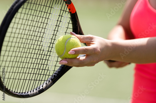 Close up of a tennis player hitting the ball with racket © Angelov