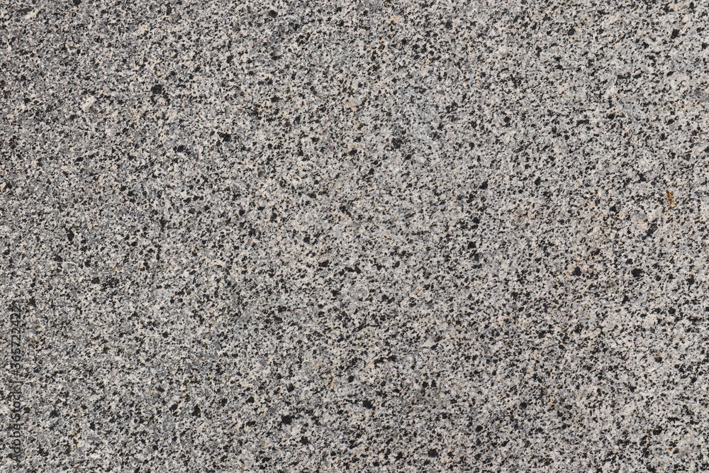 Grey marble background with grey and black flecks, top view Grey marble background with grey and black flecks, top view