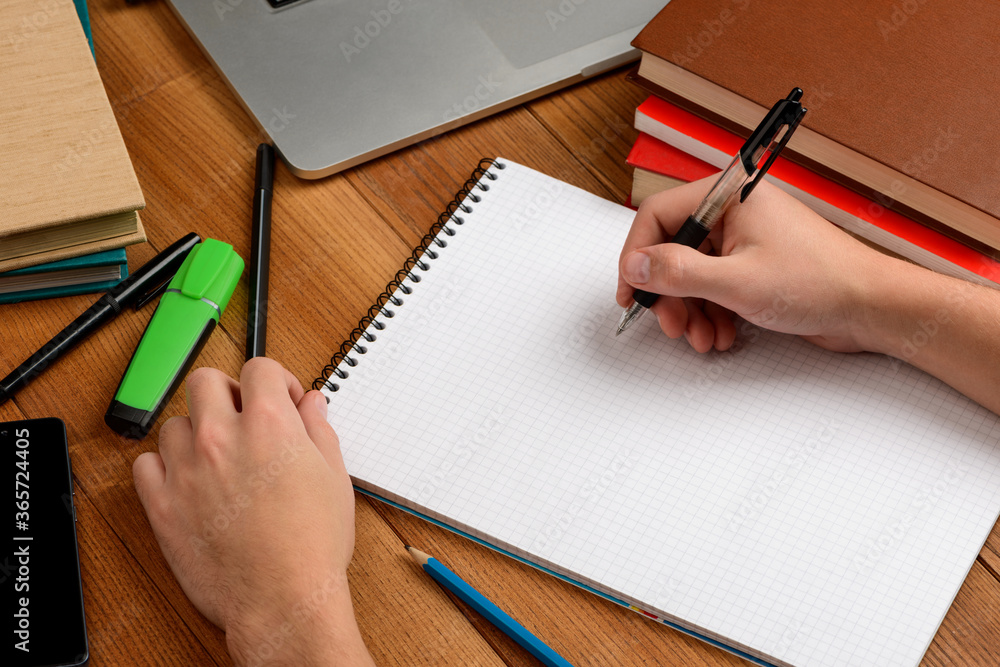 Worker writing in a notepad, making notes or summary Worker writing in a notepad, making notes or summary