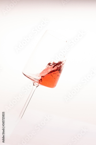 Glass of rose lambrusco wine in a splash photo