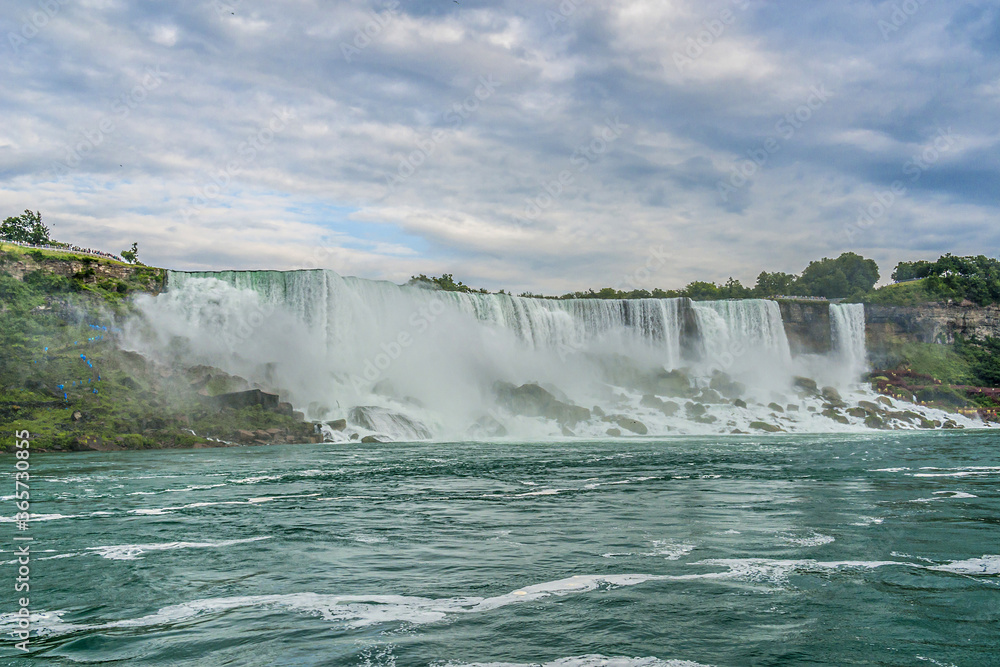 Niagara Falls close-up in the day. Ontario, Canada. Niagara Falls close-up in the day. Ontario, Canada.