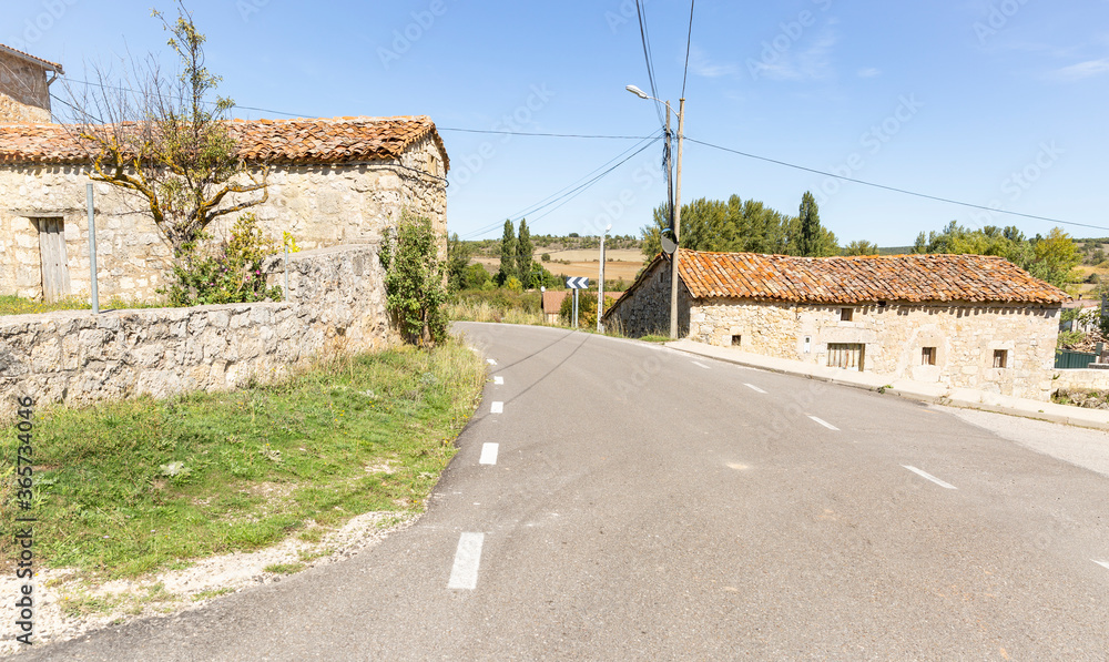 a paved road passing through Modubar de San Cibrian, province of Burgos, Castile and Leon, Spain
