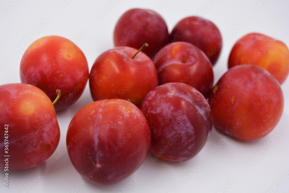 Red, cherry early variety of cherry plum early, which grows and grows on the territory of Ukraine. Delicious sweet summer fruits, fresh and healthy fruits in the human diet.